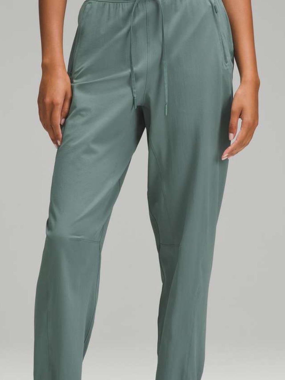 lululemon athletica license to train high rise pants in the color medium forest